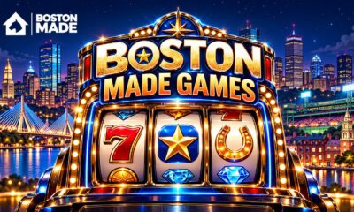 Boston Made Games slot machine glowing in front of the Boston skyline
