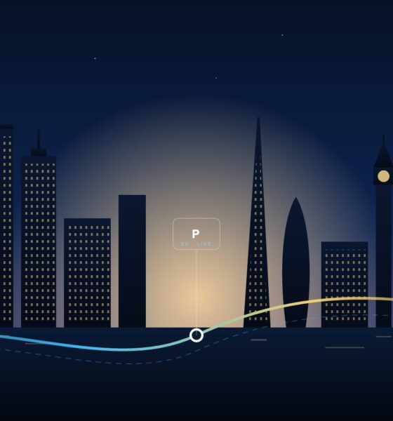 Illustrated Boston and London skylines joined by a glowing transit line with an EV parking hub between them