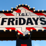 Classic TGI Fridays marquee sign with red-and-white stripes