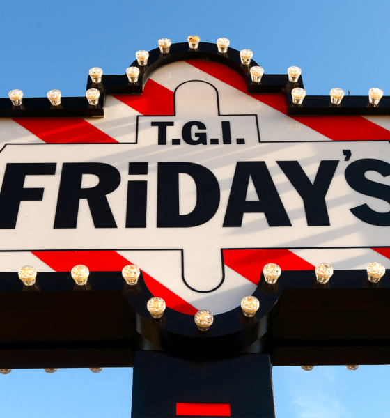Classic TGI Fridays marquee sign with red-and-white stripes