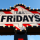 Classic TGI Fridays marquee sign with red-and-white stripes