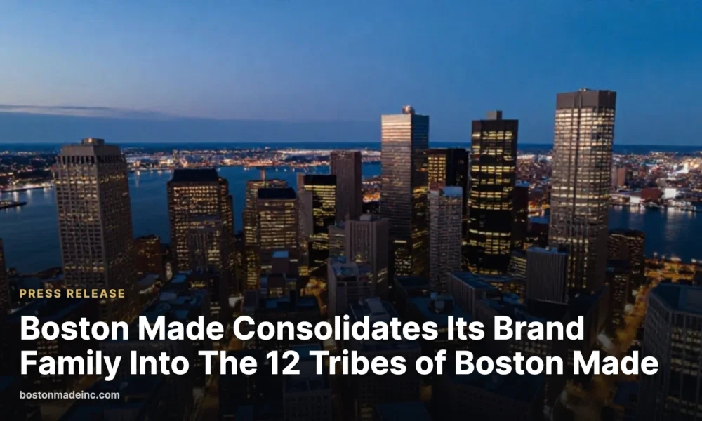 Downtown Boston at blue hour seen from above with lit buildings and the harbor.