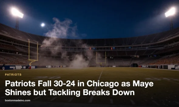 An empty NFL stadium field under floodlights on a cold October night.