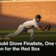Baseball outfielder diving for a catch on an outfield at dusk