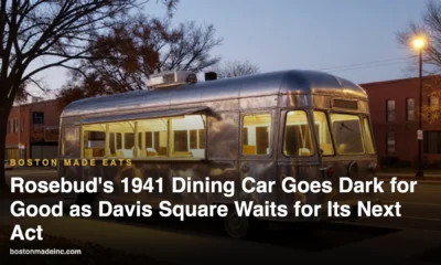 Illustration of a vintage stainless-steel lunch car diner on a city corner at dusk, lights off