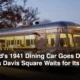 Illustration of a vintage stainless-steel lunch car diner on a city corner at dusk, lights off