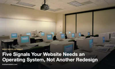 Rows of desktop computers in a bright training room